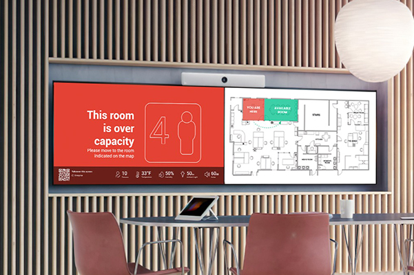 Cisco Webex Room Kit with large screens and table and chairs